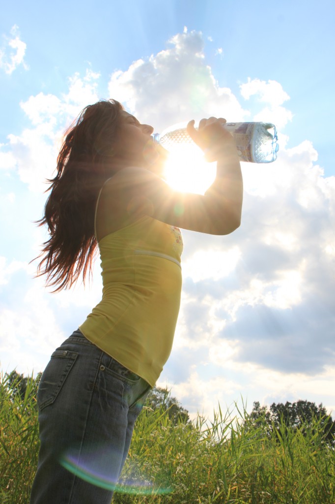 Young-Woman-Drinking-Water_Summer-Sun