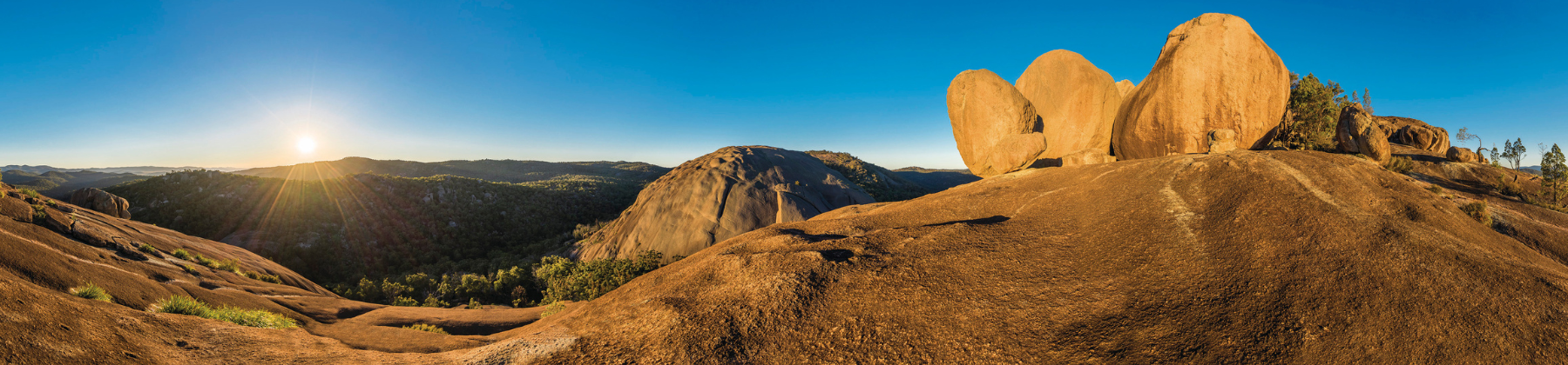 Image of two walkers next to the pyramid on Girraween National Park