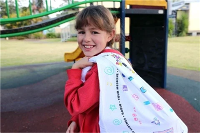 Girl carrying a pillow case