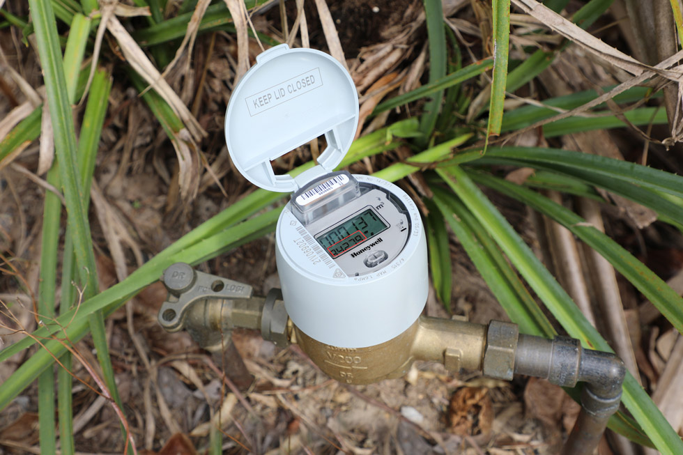 Picture contains an photograph of a smart water meter.