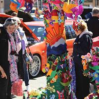 Jumpers and Jazz in July event attendees looking at colourful tree